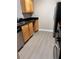 Kitchen featuring stainless steel appliances, black countertops, and wooden cabinetry at 2065 Dixie Belle Dr # O, Orlando, FL 32812