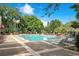 Resort-style pool with lounge chairs and well-maintained grounds offers a relaxing oasis at 2065 Dixie Belle Dr # O, Orlando, FL 32812