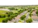 Aerial perspective of homes in a community near a lake and golf course, surrounded by lush greenery at 2173 Caledonian St, Clermont, FL 34711