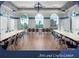 Arts and crafts center with tables, chairs, arched windows, and hardwood floors at 2173 Caledonian St, Clermont, FL 34711