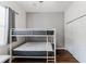 Bedroom featuring bunk beds with gray mattresses and a closet with sliding doors at 2173 Caledonian St, Clermont, FL 34711
