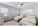 Bright bedroom featuring two twin beds with padded benches at the end at 2173 Caledonian St, Clermont, FL 34711