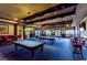 Billiard room with multiple pool tables, pendant lighting, and comfortable seating at 2173 Caledonian St, Clermont, FL 34711