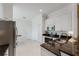 Bright kitchen with granite countertops, stainless appliances, white cabinets, and ample storage space at 2173 Caledonian St, Clermont, FL 34711