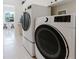 Modern laundry room equipped with new LG washer and dryer units at 2173 Caledonian St, Clermont, FL 34711