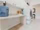 Functional laundry room with sleek washer and dryer, and ample counter space at 2173 Caledonian St, Clermont, FL 34711
