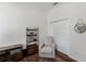 Cozy space with comfortable armchair, stylish bookshelf, and elegant rug at 2173 Caledonian St, Clermont, FL 34711