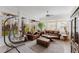 Cozy sunroom featuring tile flooring, large windows, and comfortable leather seating at 2173 Caledonian St, Clermont, FL 34711