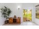 Bright sunroom featuring tile flooring, an antique hutch, and sliding glass doors at 2173 Caledonian St, Clermont, FL 34711