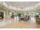 Bright and spacious lobby featuring elegant furniture, a chandelier, and neutral decor at 2173 Caledonian St, Clermont, FL 34711