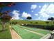 Outdoor shuffleboard courts surrounded by green lawns and flowering trees at 2173 Caledonian St, Clermont, FL 34711
