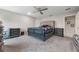 Spacious bedroom featuring neutral walls, plush carpet, ceiling fan and ample natural light at 220 Foxtail Loop, Davenport, FL 33837