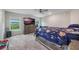Bedroom features two windows, and a beautiful area rug at 220 Foxtail Loop, Davenport, FL 33837