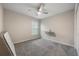 Empty bedroom with a ceiling fan, carpet, and natural light at 220 Foxtail Loop, Davenport, FL 33837