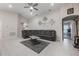 Spacious living room featuring neutral tones, recessed lighting, tile floors, and modern decor at 220 Foxtail Loop, Davenport, FL 33837