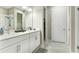 Bathroom featuring double sink vanity and shower at 2491 Wadeview Loop, St Cloud, FL 34769