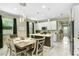 Bright dining area featuring a modern chandelier and views of the updated kitchen at 2491 Wadeview Loop, St Cloud, FL 34769