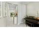 Hallway view of home's neutral color palette, updated lighting, and tile flooring at 2491 Wadeview Loop, St Cloud, FL 34769