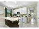 Modern kitchen with white cabinets, stainless steel appliances, and a center island at 2491 Wadeview Loop, St Cloud, FL 34769