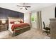 Primary bedroom with a decorative wall, large window, and carpeted floors at 2491 Wadeview Loop, St Cloud, FL 34769