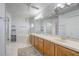 Bright bathroom featuring a soaking tub, double vanity, and a separate glass shower at 2800 Woodsmere Ct, Kissimmee, FL 34746