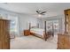 Bedroom with carpet, ceiling fan, and natural light with a sliding door to the outdoors at 2800 Woodsmere Ct, Kissimmee, FL 34746