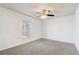 Bedroom featuring neutral paint, carpet, and a window to let in natural light at 2800 Woodsmere Ct, Kissimmee, FL 34746