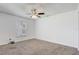 Bedroom featuring neutral paint, carpet, and a window to let in natural light at 2800 Woodsmere Ct, Kissimmee, FL 34746