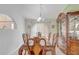 Formal dining room with ornate furniture and decor, showcasing classic style at 2800 Woodsmere Ct, Kissimmee, FL 34746