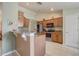 Well-equipped kitchen with wood cabinets, stainless steel appliances, and tile flooring at 2800 Woodsmere Ct, Kissimmee, FL 34746