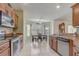 Eat-in kitchen features tile flooring, granite countertops and stainless steel appliances at 2800 Woodsmere Ct, Kissimmee, FL 34746