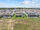 An aerial view showcases homes with screened-in patios, pools, and manicured lawns at 3179 Sailing Pier Ave, Winter Garden, FL 34787