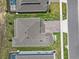 Aerial view of the roof of the home including a brick-paved driveway and landscaping at 3179 Sailing Pier Ave, Winter Garden, FL 34787