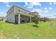 Two-story home featuring a large, green backyard and a screened-in patio area, perfect for outdoor entertaining at 3179 Sailing Pier Ave, Winter Garden, FL 34787