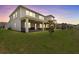 Two-story home featuring a large, green backyard and a screened-in patio area at 3179 Sailing Pier Ave, Winter Garden, FL 34787