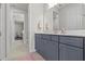 Bathroom with vanity and mirror with view to connecting rooms, providing easy access and functionality at 3179 Sailing Pier Ave, Winter Garden, FL 34787