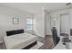 Comfortable bedroom features a window and a desk for working at 3179 Sailing Pier Ave, Winter Garden, FL 34787