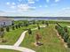 A landscaped community park and garden area with a lakeside walking path at 3179 Sailing Pier Ave, Winter Garden, FL 34787