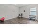 This exercise room boasts workout equipment and sleek laminate floors at 3179 Sailing Pier Ave, Winter Garden, FL 34787