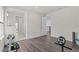 Spacious exercise area with laminate floors and access to more rooms at 3179 Sailing Pier Ave, Winter Garden, FL 34787