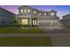 Charming two-story home featuring a three-car garage and beautifully landscaped front yard at 3179 Sailing Pier Ave, Winter Garden, FL 34787