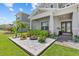 This home boasts a nicely designed yard with small palms, colorful flowers, and bright white stones at 3179 Sailing Pier Ave, Winter Garden, FL 34787