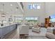 Bright living room featuring open concept design, with abundant natural light, and luxury vinyl flooring at 3179 Sailing Pier Ave, Winter Garden, FL 34787