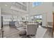 Bright open concept featuring eat-in kitchen, high ceilings, abundant natural light, and luxury vinyl flooring at 3179 Sailing Pier Ave, Winter Garden, FL 34787
