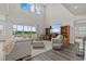 Bright living room featuring high ceilings, abundant natural light, and luxury vinyl flooring at 3179 Sailing Pier Ave, Winter Garden, FL 34787