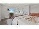 Spacious main bedroom with a wooden bed, TV, and makeup vanity at 3179 Sailing Pier Ave, Winter Garden, FL 34787