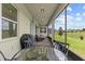 Relaxing screened patio with comfortable seating and outdoor dining area with picturesque backyard views at 3179 Sailing Pier Ave, Winter Garden, FL 34787