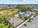 Aerial view of a community playground with a lake view, splash pad, and picnic pavilion at 3179 Sailing Pier Ave, Winter Garden, FL 34787