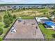 Aerial view of the community playground with various play structures, swings, and a picnic area at 3179 Sailing Pier Ave, Winter Garden, FL 34787