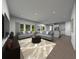 Spacious living room with two sofas, recessed lighting, large windows, and an open floor plan at 3674 Portsmouth Ln, Haines City, FL 33844